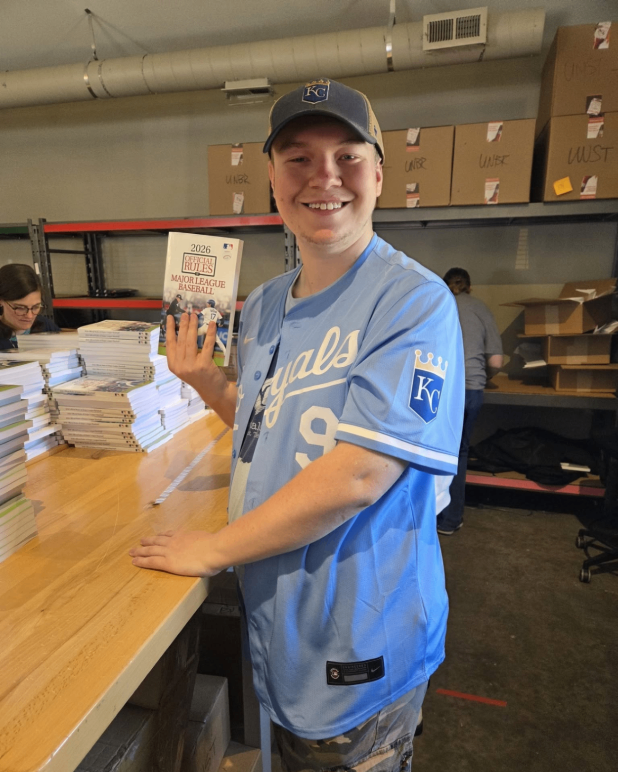 Associate scanning a book at a fulfillment station
